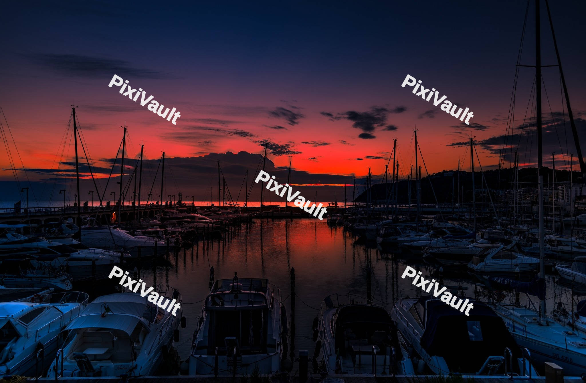 Yacht marina in the sea at sunset